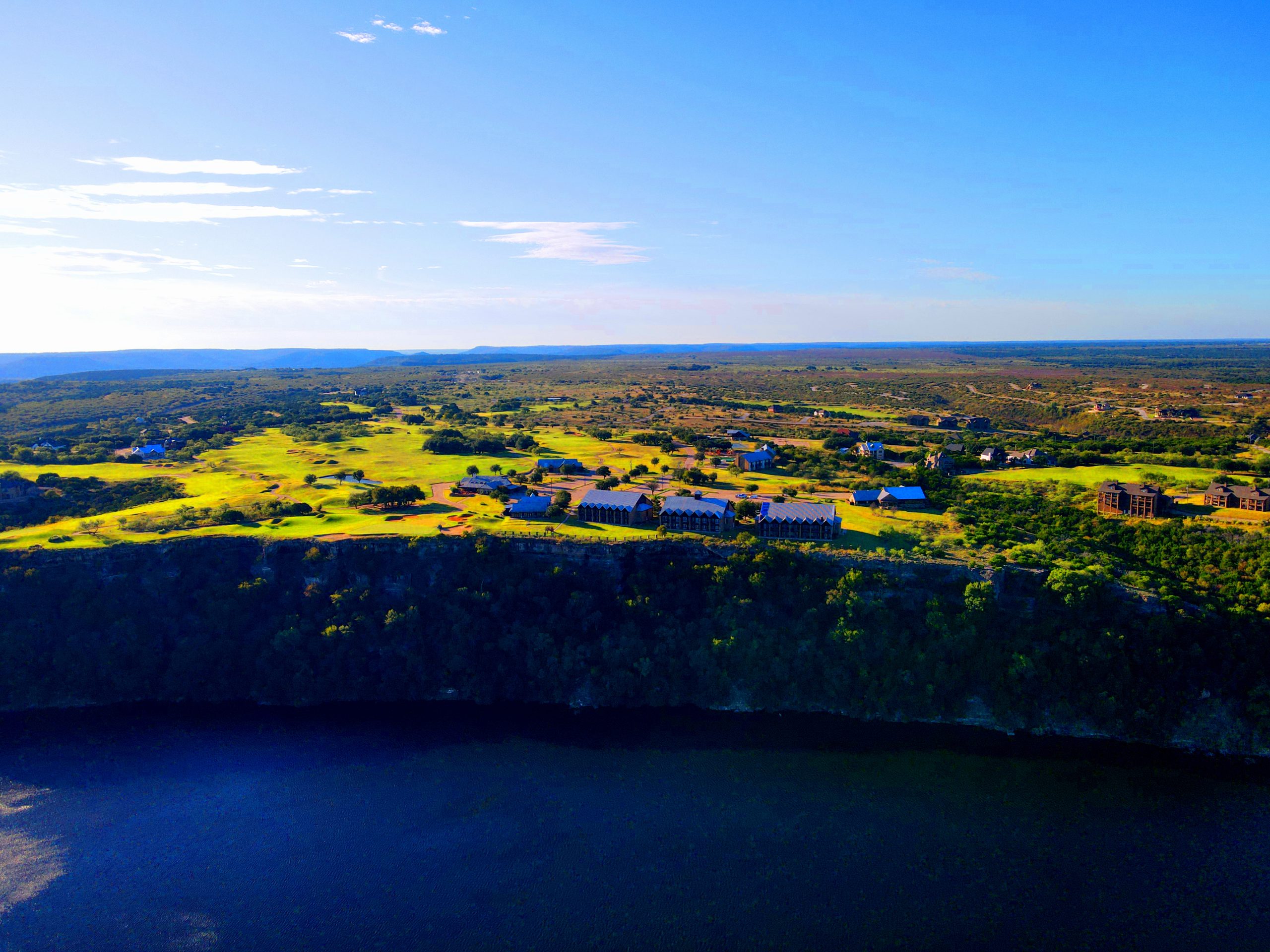 Aerial photo of the cliff line, hotel, and some of the golf course in The Cliffs Resort