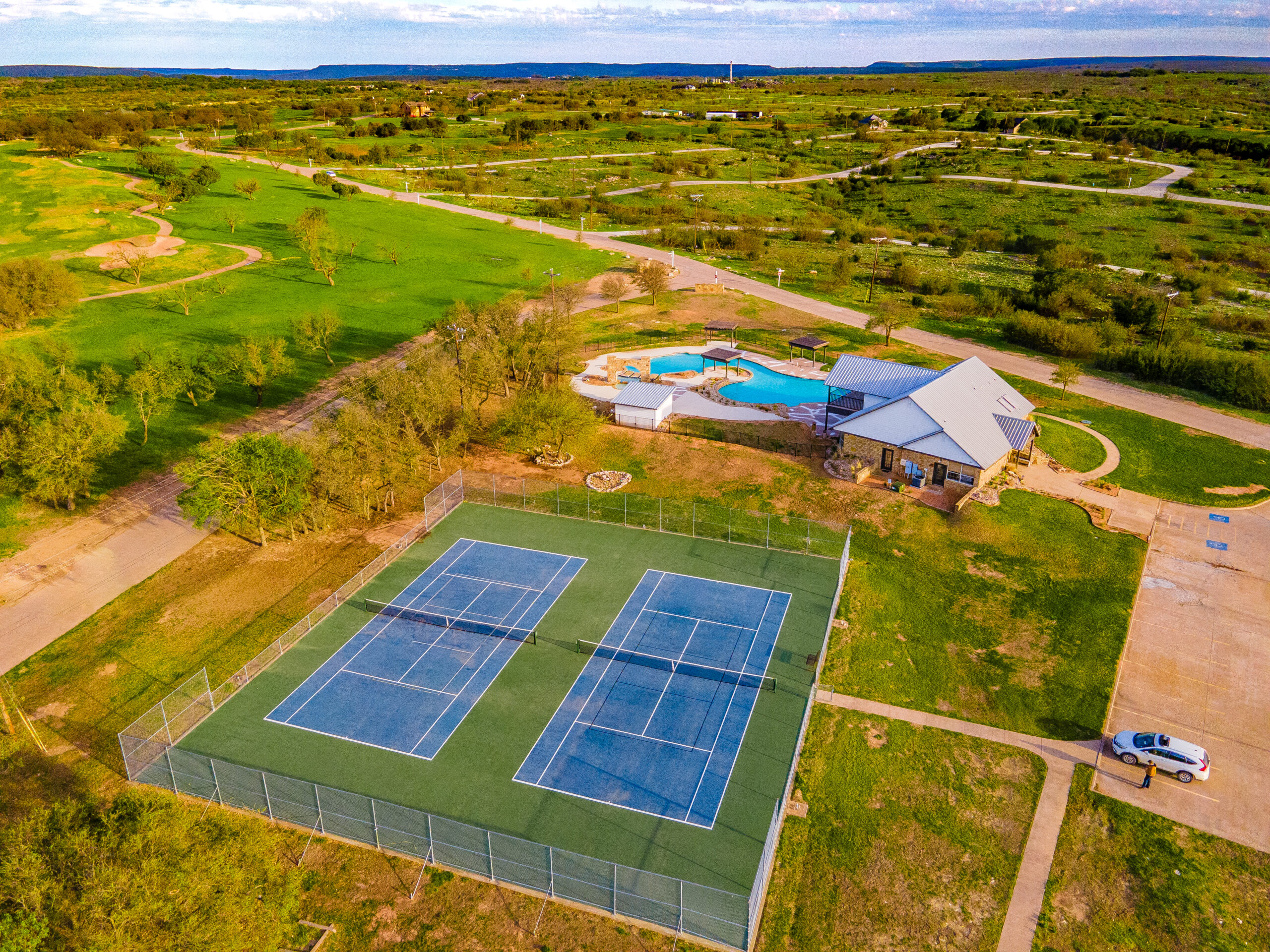 Tennis court, pool, and club house in The Cliffs Resort