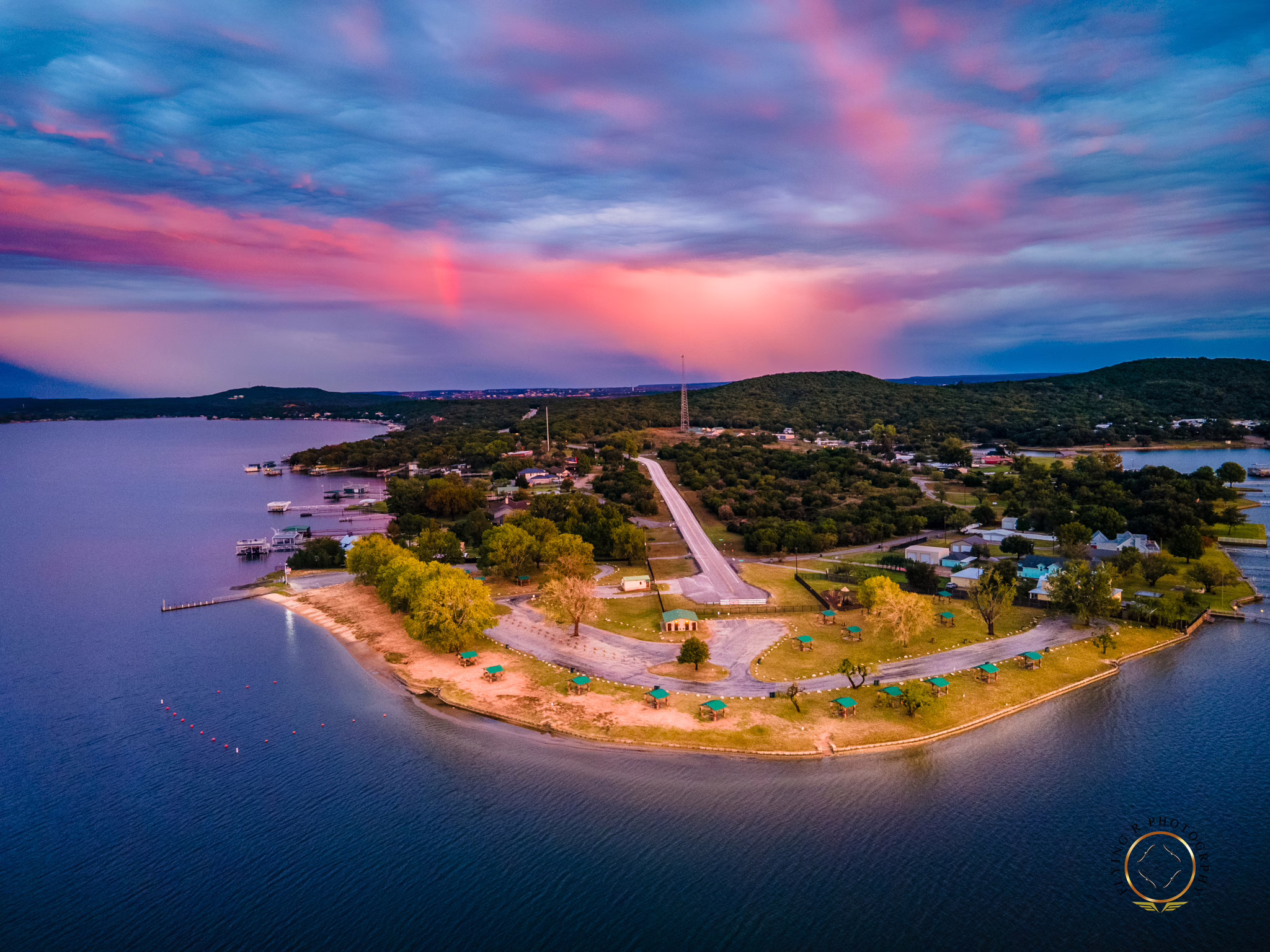 Sunset aerial drone photograph of Sandy Beach Park on the PK Peninsula at Possum Kingdom Lake in Texas.